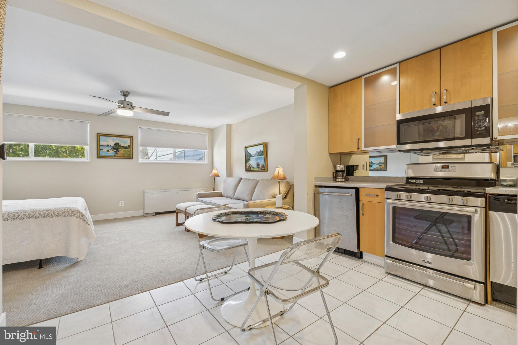 2829 Connecticut Avenue Northwest, Unit 107 Washington, DC 20008 - Photo 3 of 13 a kitchen with stainless steel appliances a stove a sink and a microwave