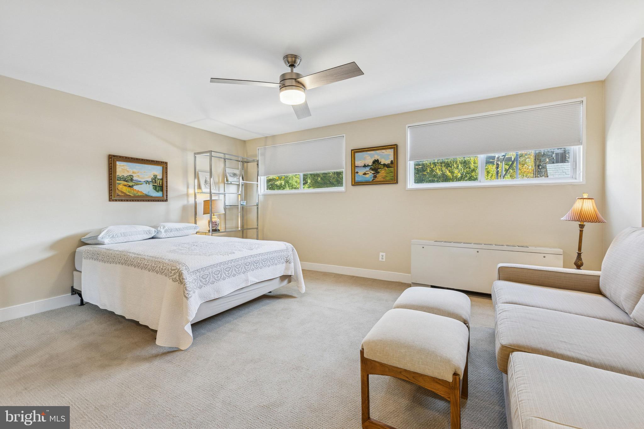 2829 Connecticut Avenue Northwest, Unit 107 Washington, DC 20008 - Photo 5 of 13 a bedroom with a bed and a couch