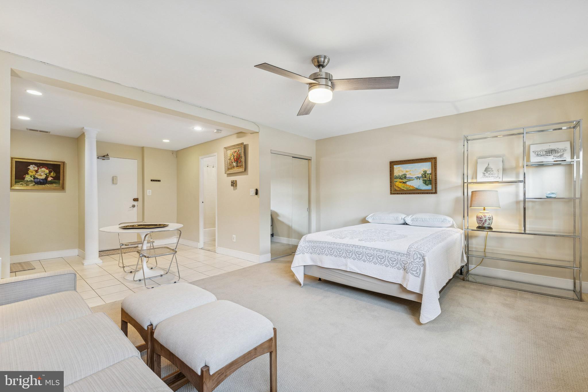 2829 Connecticut Avenue Northwest, Unit 107 Washington, DC 20008 - Photo 6 of 13 a spacious bedroom with a bed and a chandelier