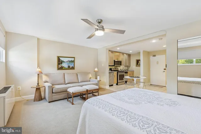 a bedroom with furniture and a large mirror