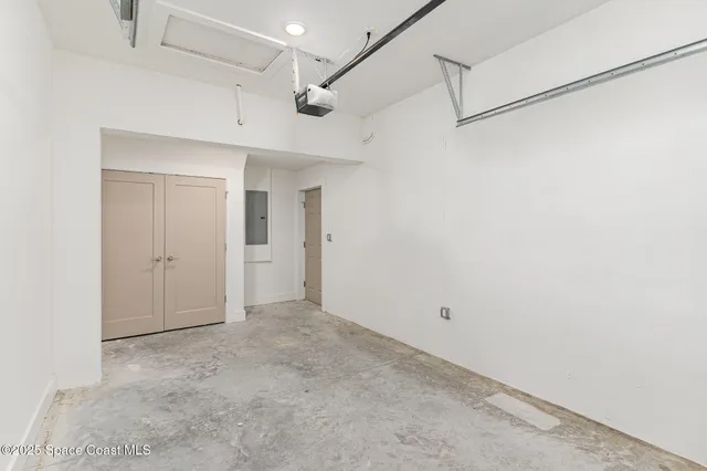 a view of a big room with a ceiling fan