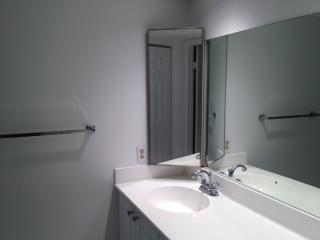 601 Springdale Circle Palm Springs, FL 33461 - Photo 11 of 14 a bathroom with a sink and a mirror
