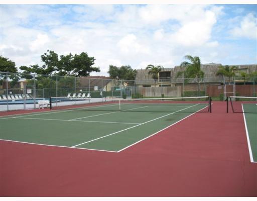 601 Springdale Circle Palm Springs, FL 33461 - Photo 14 of 14 a view of a tennis court