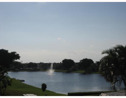 601 Springdale Circle Palm Springs, FL 33461 - Photo 3 of 14 a view of lake with mountain