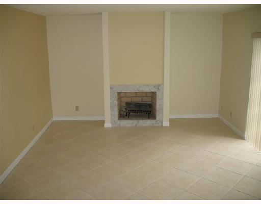 601 Springdale Circle Palm Springs, FL 33461 - Photo 5 of 14 a view of empty room with a fireplace