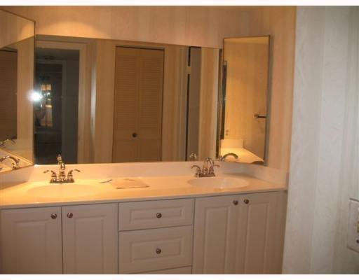 601 Springdale Circle Palm Springs, FL 33461 - Photo 6 of 14 a bathroom with a sink and a mirror