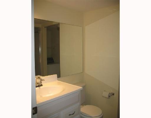 601 Springdale Circle Palm Springs, FL 33461 - Photo 7 of 14 a bathroom with a granite countertop toilet and a sink