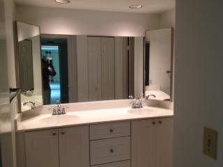 601 Springdale Circle Palm Springs, FL 33461 - Photo 10 of 14 a bathroom with a sink and a mirror