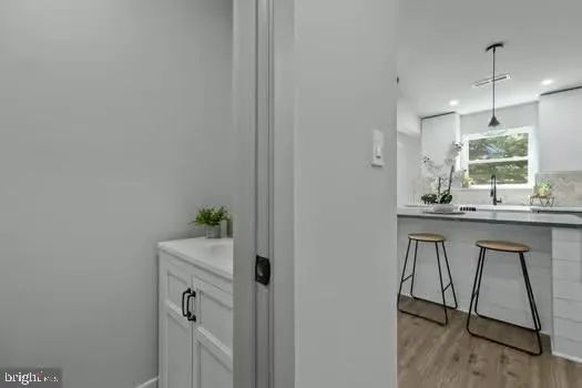 a bathroom with a sink a mirror and a window