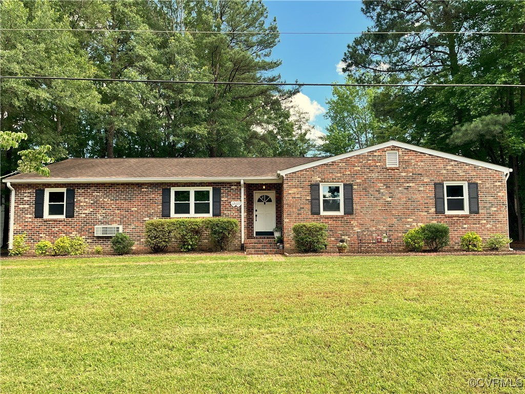 12027 Old Buckingham Road Midlothian, VA 23113 - Photo 1 of 40 a view of a house with a yard and potted plants
