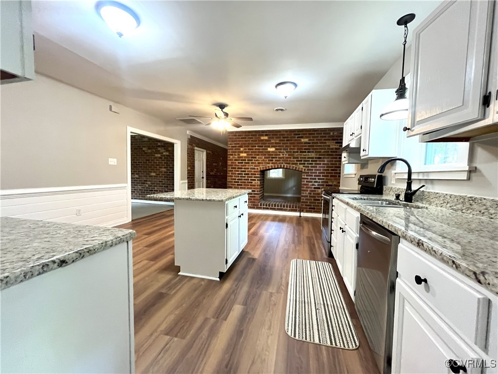 12027 Old Buckingham Road Midlothian, VA 23113 - Photo 13 of 40 a kitchen with a sink and cabinets