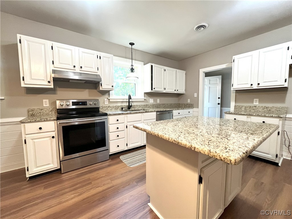 12027 Old Buckingham Road Midlothian, VA 23113 - Photo 14 of 40 a kitchen with stainless steel appliances granite countertop a sink stove and refrigerator
