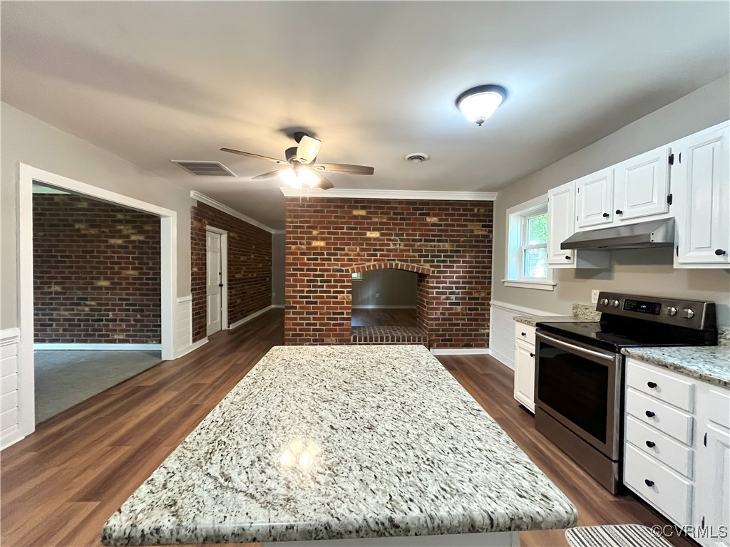 12027 Old Buckingham Road Midlothian, VA 23113 - Photo 16 of 40 a large kitchen with cabinets appliances and a rug
