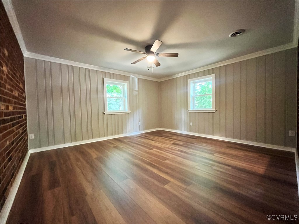 12027 Old Buckingham Road Midlothian, VA 23113 - Photo 17 of 40 an empty room with wooden floor and windows