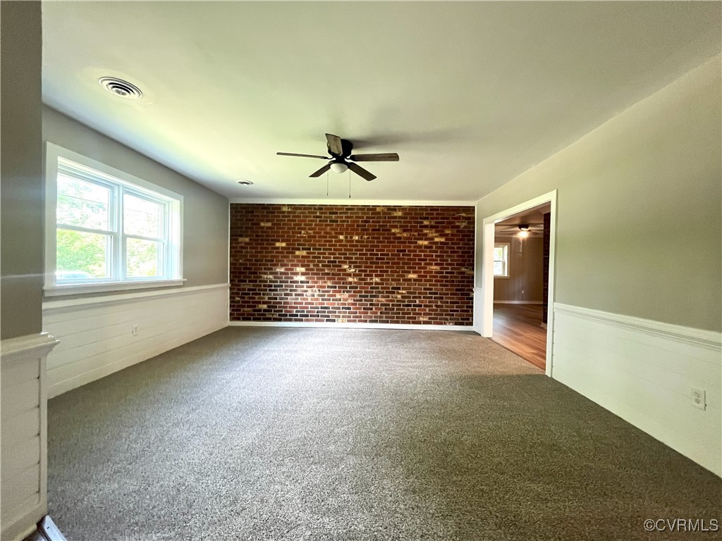 12027 Old Buckingham Road Midlothian, VA 23113 - Photo 18 of 40 an empty room with windows and ceiling fan