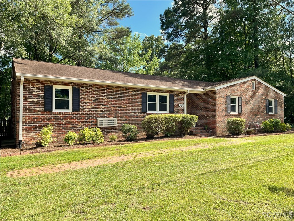 12027 Old Buckingham Road Midlothian, VA 23113 - Photo 2 of 40 a front view of house with yard and green space