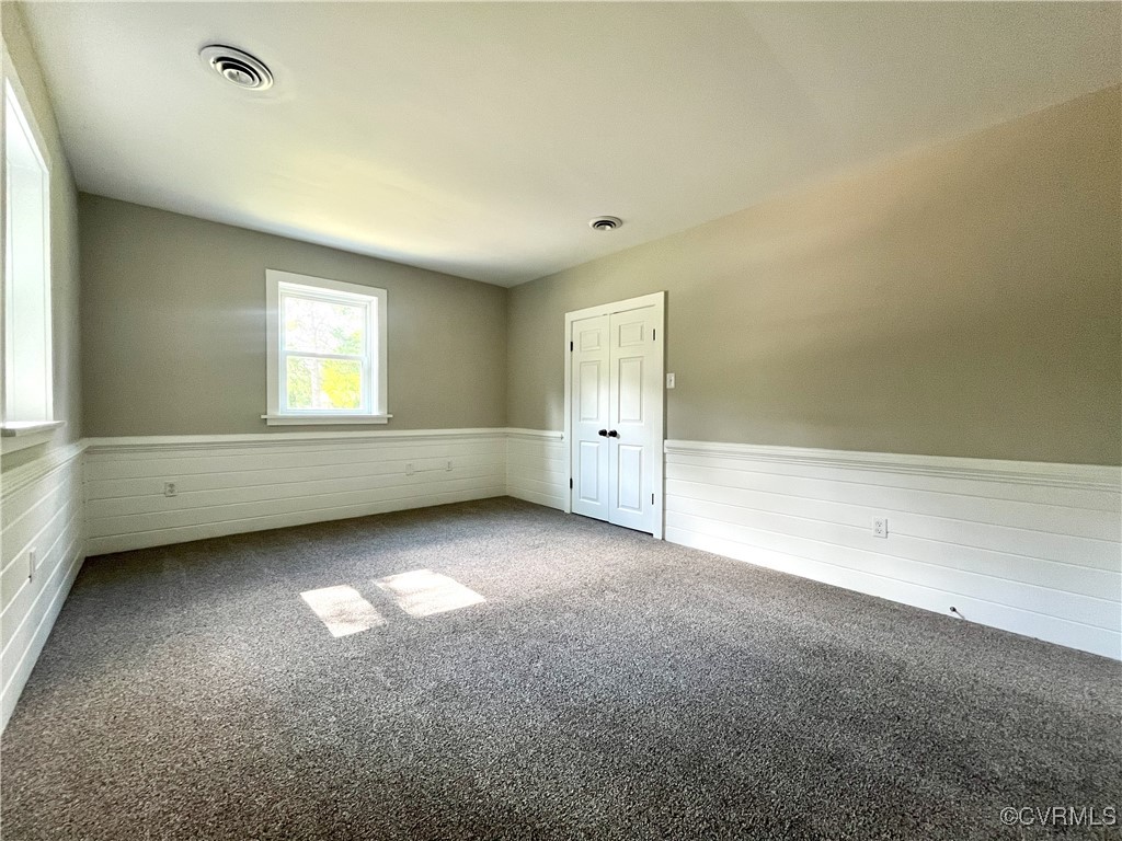 12027 Old Buckingham Road Midlothian, VA 23113 - Photo 22 of 40 an empty room with a window and a fireplace