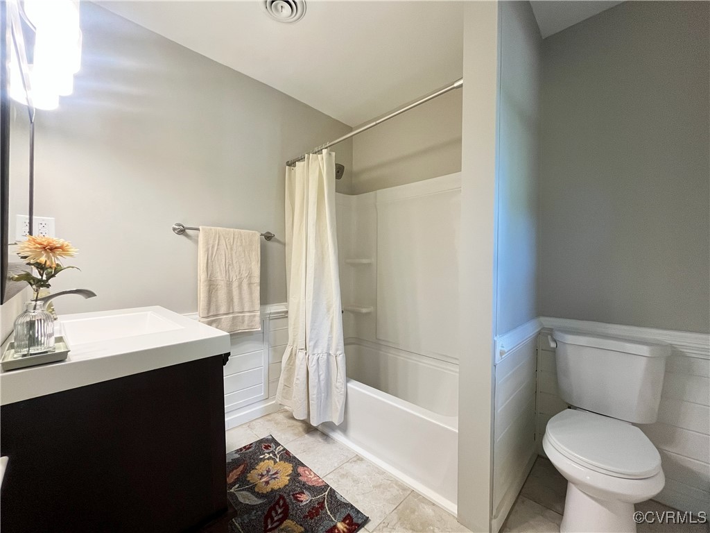 12027 Old Buckingham Road Midlothian, VA 23113 - Photo 24 of 40 a bathroom with a sink toilet and shower