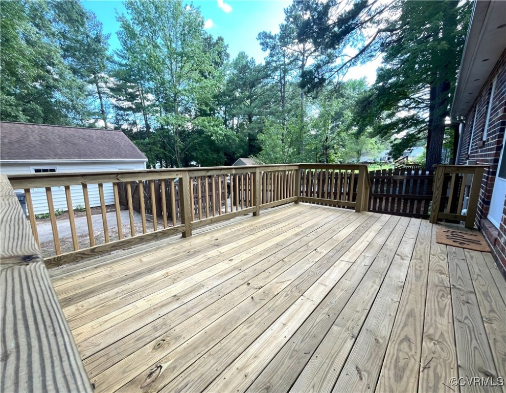 12027 Old Buckingham Road Midlothian, VA 23113 - Photo 35 of 40 a balcony with wooden floor and trees