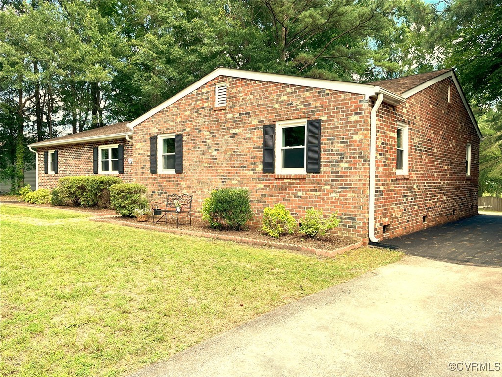 12027 Old Buckingham Road Midlothian, VA 23113 - Photo 5 of 40 a view of a house with a yard