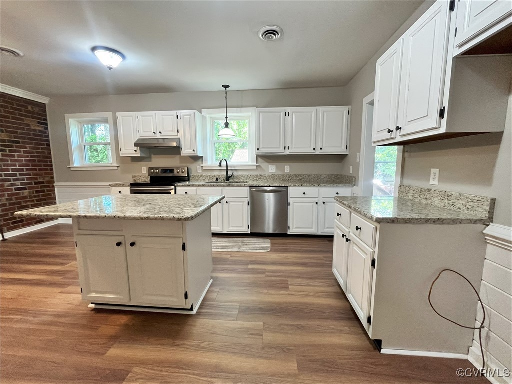 12027 Old Buckingham Road Midlothian, VA 23113 - Photo 7 of 40 a kitchen with granite countertop white cabinets white appliances a sink and dishwasher