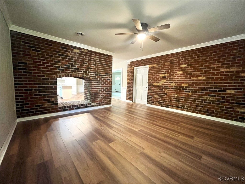 12027 Old Buckingham Road Midlothian, VA 23113 - Photo 9 of 40 a view of an empty room with wooden floor