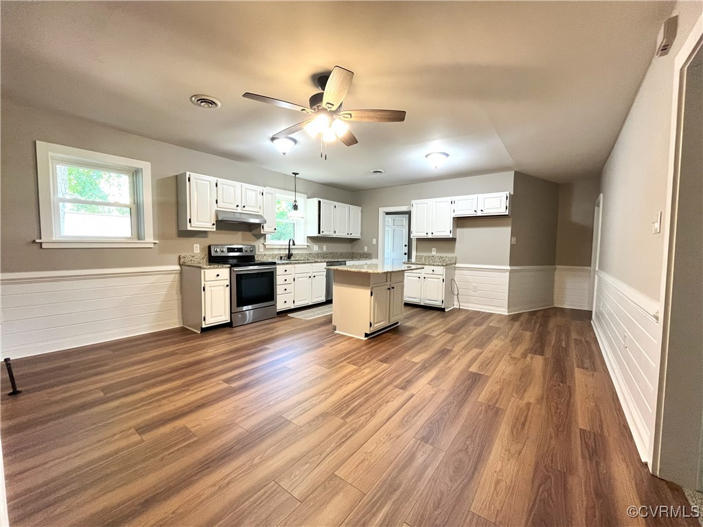 12027 Old Buckingham Road Midlothian, VA 23113 - Photo 10 of 40 a view of a kitchen with wooden floor a sink a refrigerator and window