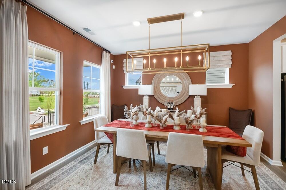 717 Bolera Road Knightdale, NC 27545 - Photo 7 of 43 a view of a dining room with furniture window and outside view