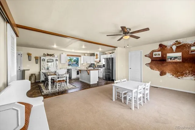 a living room with furniture and white walls