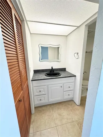 a bathroom with a toilet and shower