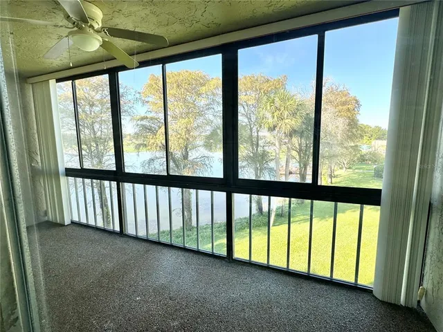 a view of a house with swimming pool and a yard