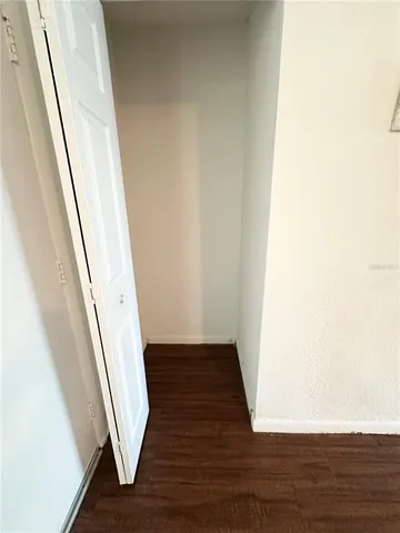 a view of an entryway with wooden floor