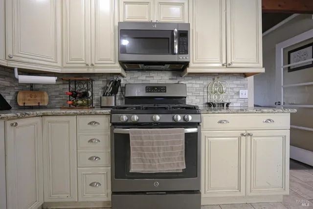 a view of an empty room window and wooden floor