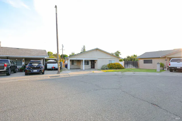 a view of a car parked in front of a house