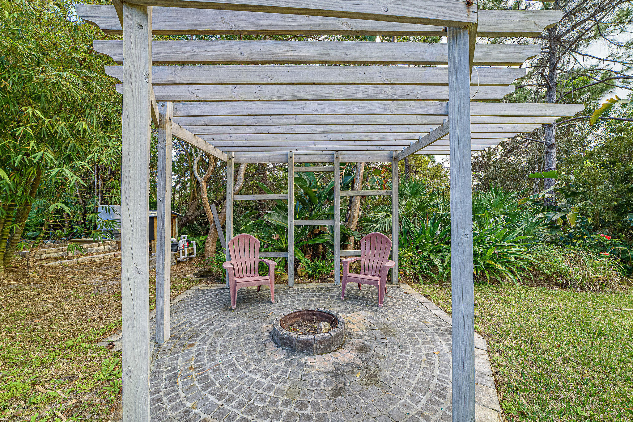 4434 Long Lake Road Melbourne, FL 32934 - Photo 43 of 53 Landscaping/Firepit 2