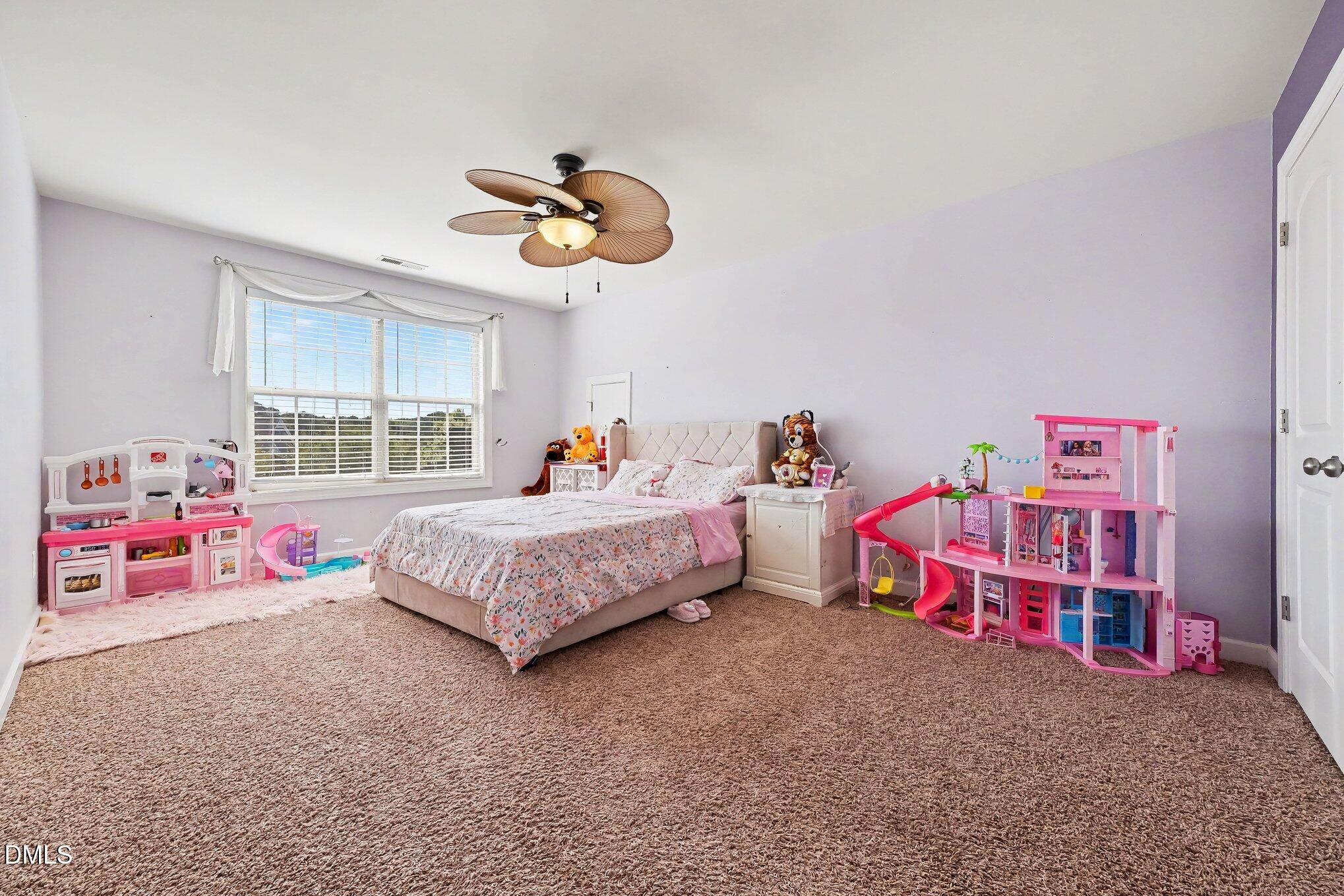 4000 Banks Stone Drive Raleigh, NC 27603 - Photo 29 of 60 a bedroom with furniture and a window