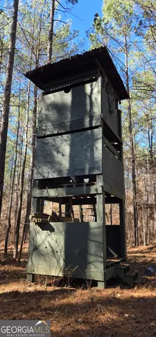 a backyard of a house with lots of trees