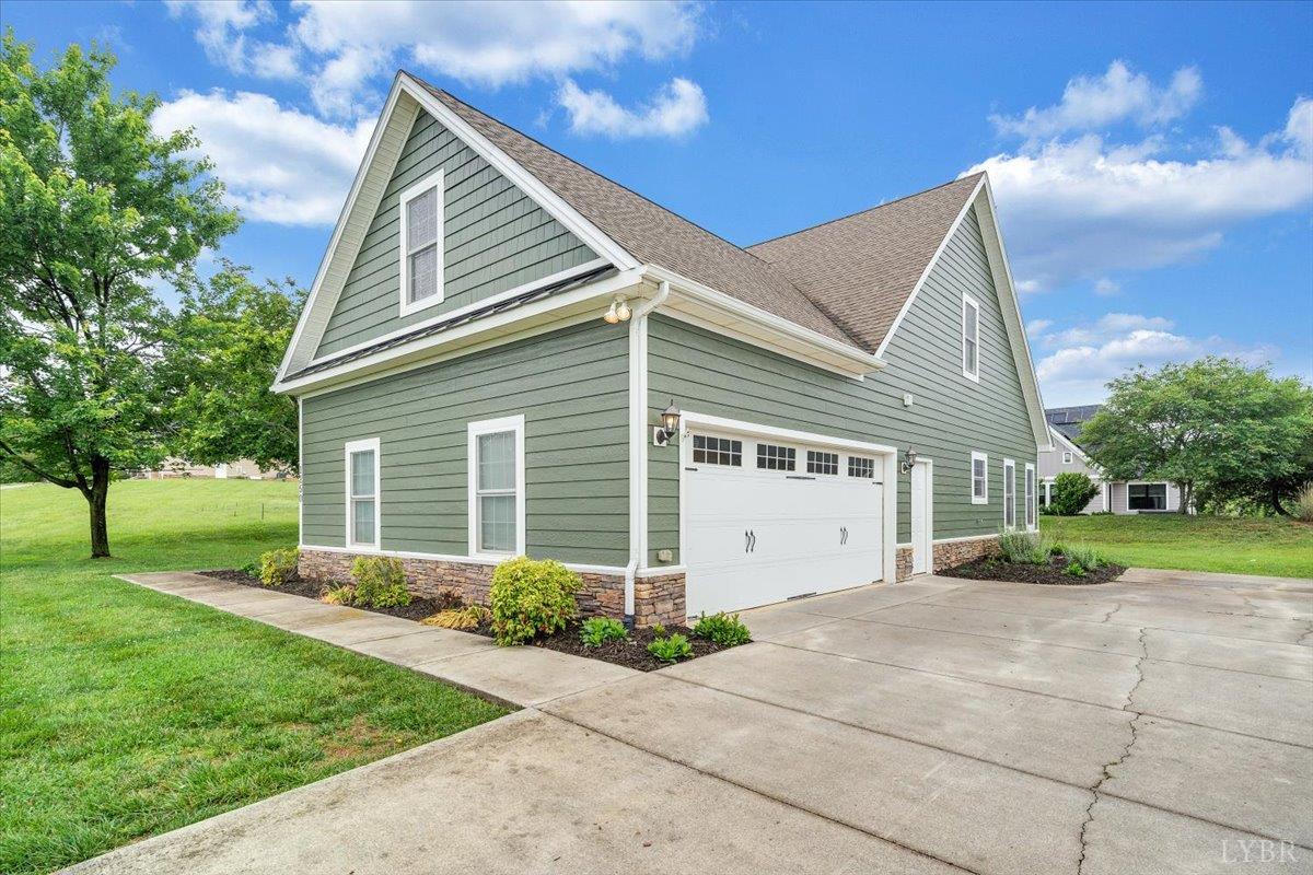 1250 Our Cove Road Huddleston, VA 24104 - Photo 55 of 70 a view of a house with a yard