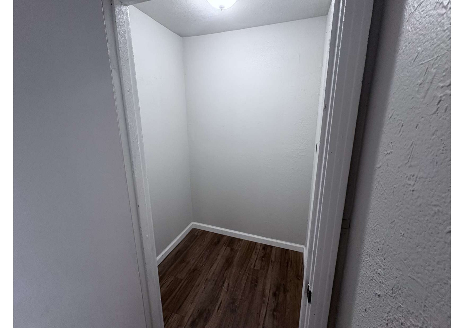 5923 Van Fleet Street Houston, TX 77033 - Photo 15 of 23 a small space with wooden floor and a window