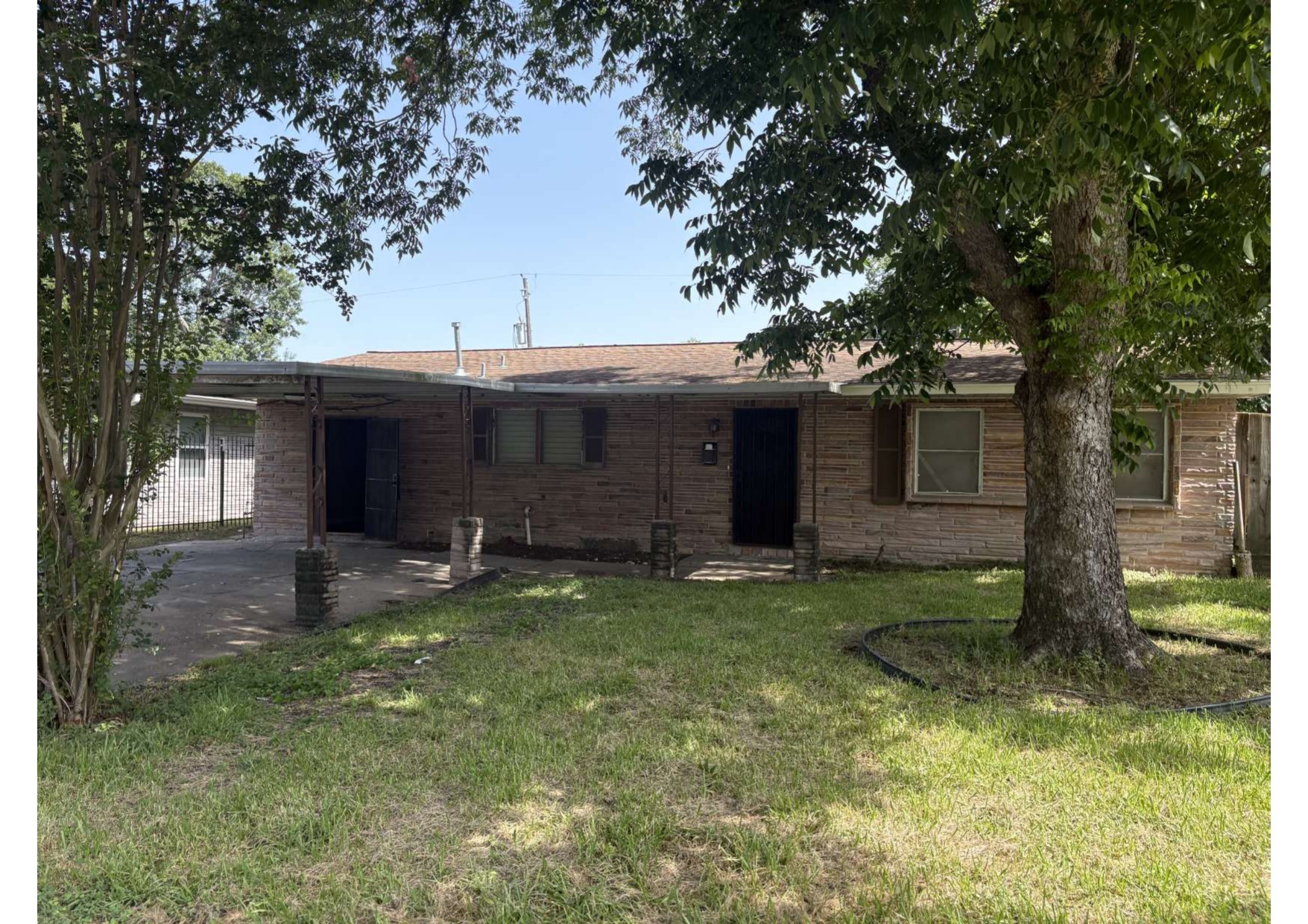 5923 Van Fleet Street Houston, TX 77033 - Photo 2 of 23 a view of a house with a yard and tree