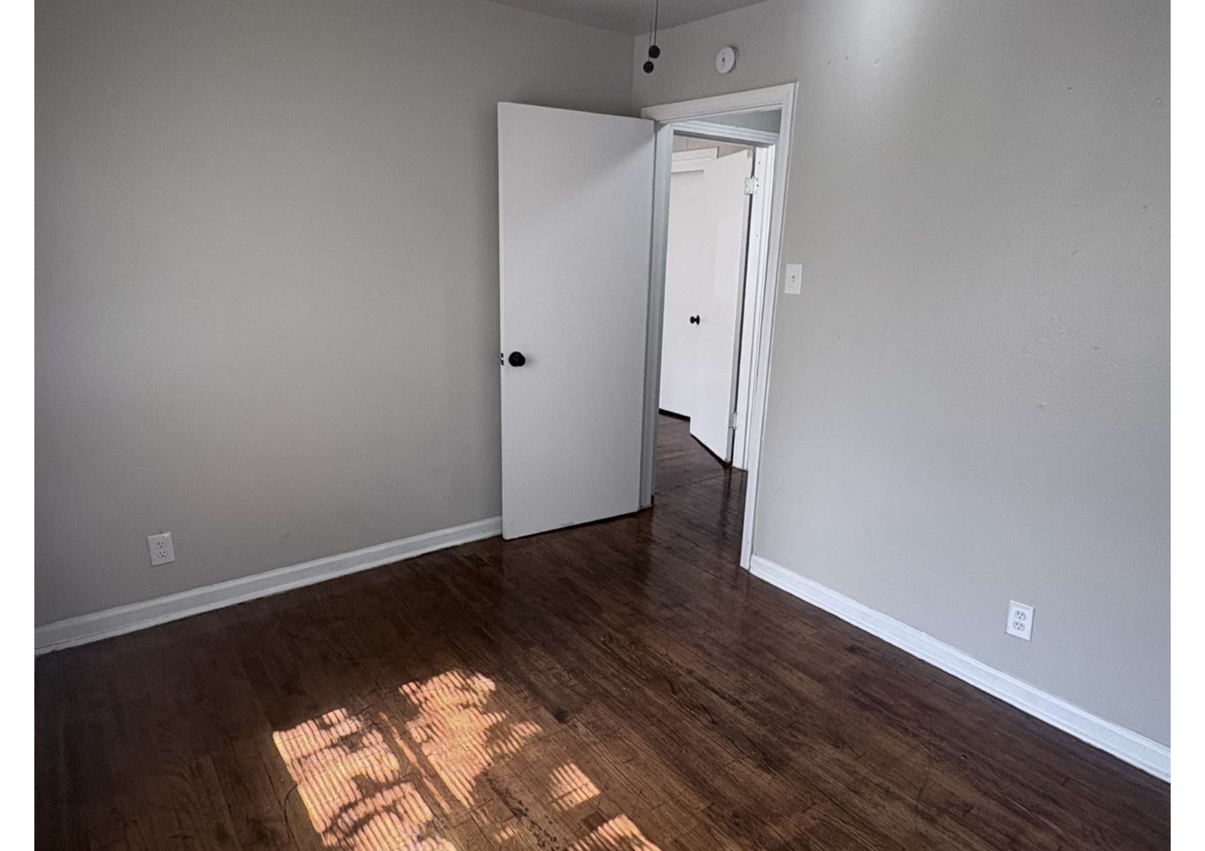 5923 Van Fleet Street Houston, TX 77033 - Photo 21 of 23 an empty room with wooden floor and closet