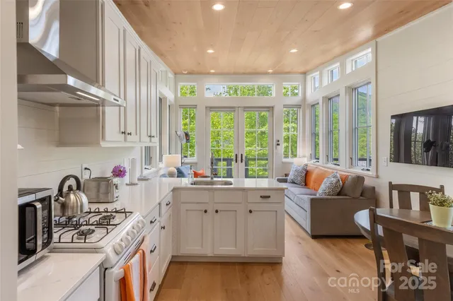 a kitchen with a sink stove and cabinets