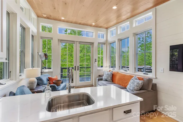 a kitchen with a large window and a couch