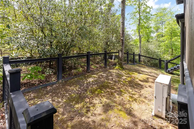 a view of a balcony with two chairs and a table