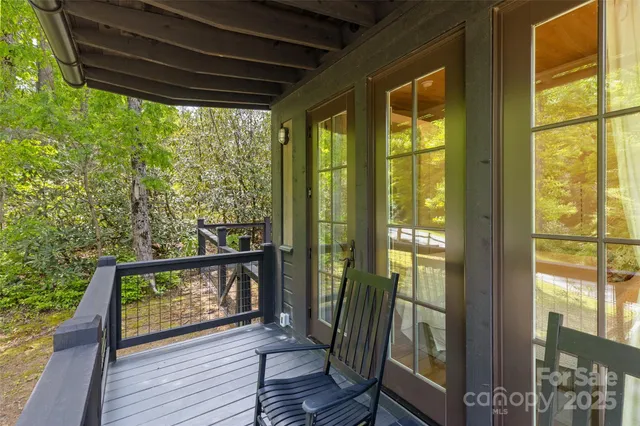 a view of a balcony with wooden floor