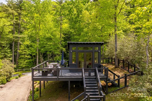 a view of a house with backyard porch and furniture