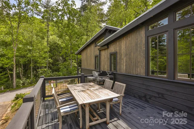 a backyard of a house with outdoor seating