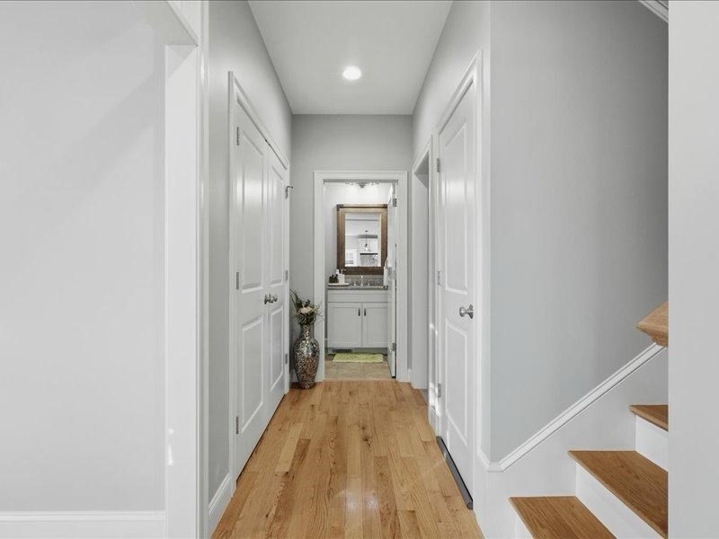 2 Aspen Drive Pelham, NH 03076 - Photo 14 of 42 a view of a hallway with wooden floor and a bathroom