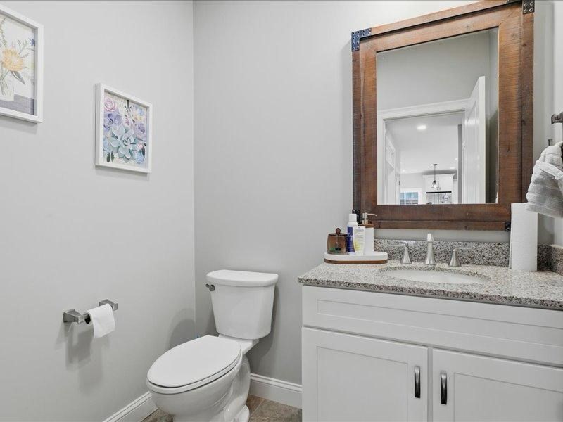 2 Aspen Drive Pelham, NH 03076 - Photo 15 of 42 a bathroom with a granite countertop toilet sink and mirror