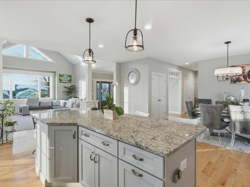 2 Aspen Drive Pelham, NH 03076 - Photo 9 of 42 a kitchen with center island table and chairs in it